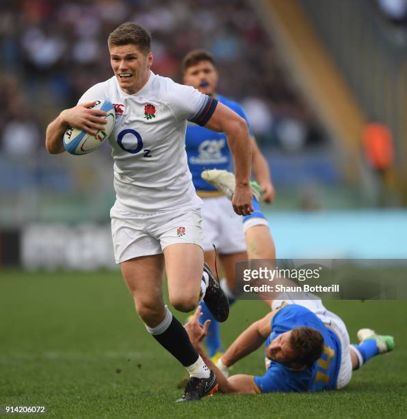 Owen Farrell of England beats the tackle of Tommaso Benvenuti of Italy to break through and score during the NatWest Six Nations match betwwen...