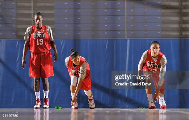 Sylvia Fowles, Lindsey Harding and Candice Dupree of the Women's USA Basketball team stretch during the National Team Fall Training Camp on October...