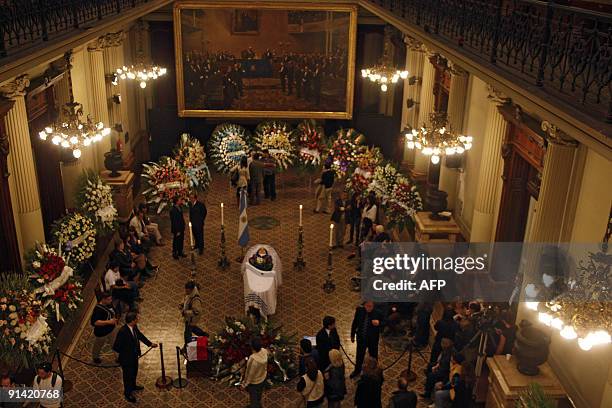 People stand next to Argentine singer Mercedes Sosa's coffin during her wake at the Congress building in Buenos Aires on October 4, 2009. Legendary...