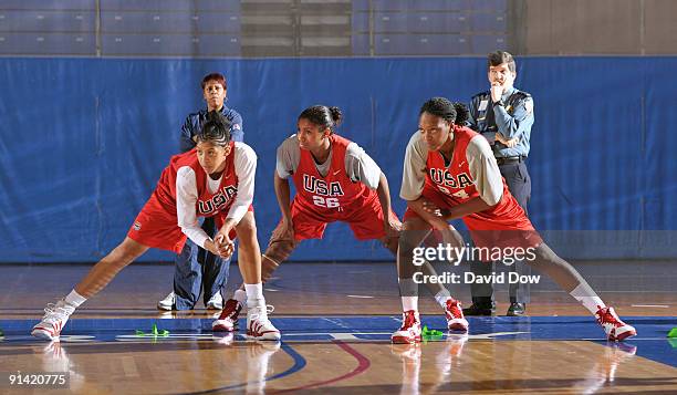 Candace Parker, Angel McCoughtry and Asjha Jones of the Women's USA Basketball team stretch during the National Team Fall Training Camp on October 4,...