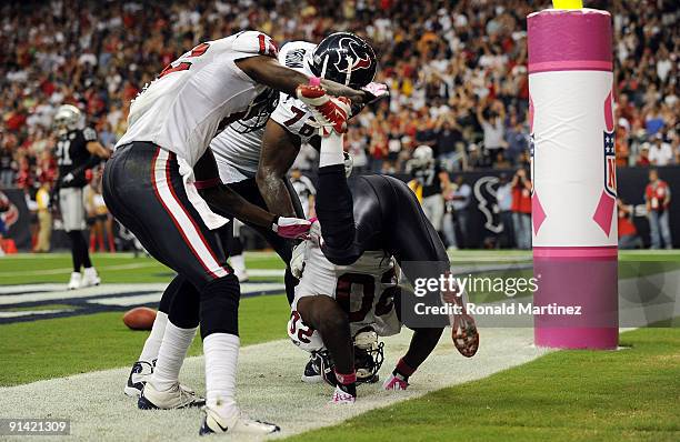 Running back Steve Slaton of the Houston Texans celebrates a touchdown against the Oakland Raiders at Reliant Stadium on October 4, 2009 in Houston,...