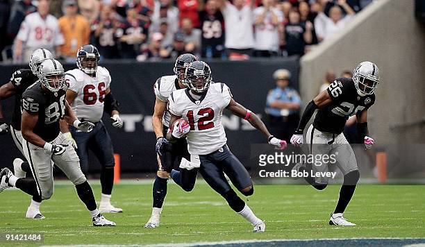 Jacoby Jones of the Houston Texans returns a free kick for 95 yards for a touchdown in the third quarter as Stanford Routt and Tony Stewert of the...