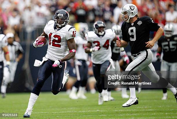 Jacoby Jones of the Houston Texans runs for a touchdown past Shane Lechler of the Oakland Raiders at Reliant Stadium on October 4, 2009 in Houston,...