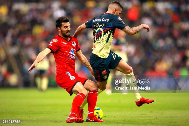 Facundo Erpen of Lobos BUAP fights for the ball with Jeremy Menez of America during the 5th round match between America and Lobos BUAP as part of the...