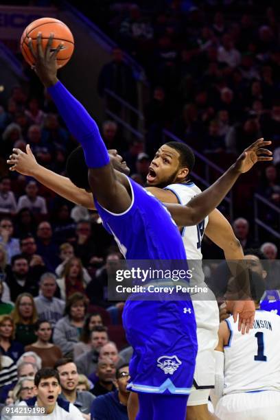 Omari Spellman of the Villanova Wildcats takes a swipe at the ball against Angel Delgado of the Seton Hall Pirates during the first half at the Wells...