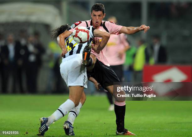 Nicola Legrottaglie of Juventus and Igor Budan of Palermo battle for the ball during the Serie A match played between US Citta di Palermo and...