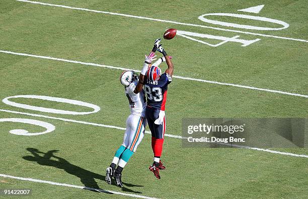 Cornerback Sean Smith of the Miami Dolphins defends a pass intended for wide receiver Lee Evans of the Buffalo Bills at Land Shark Stadium on October...