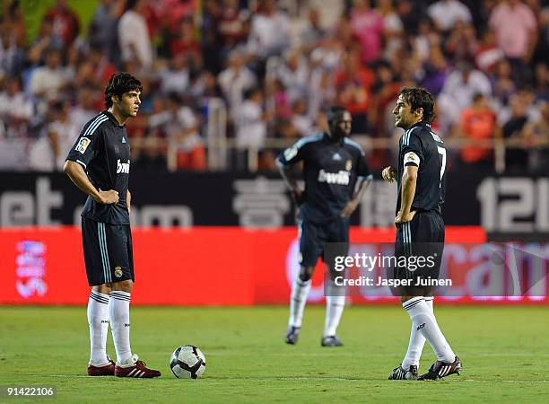 Raul Gonzalez of Real Madrid stands with his teammate Kaka waiting to resume the game after conceding a goal during the La Liga match between Sevilla...