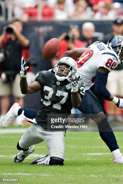Chris Johnson of the Oakland Raiders tries to catch a tipped pass against the Houston Texans at Reliant Stadium on October 4, 2009 in Houston, Texas....