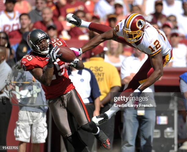 Aqib Talib of the Tampa Bay Buccaneers intercepts the ball against Malcolm Kelly of the Washington Redskins at FedExField on October 4, 2009 in...