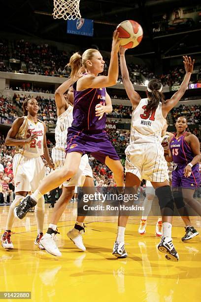 Penny Taylor of the Phoenix Mercury passes the ball against Jessica Moore of the Indiana Fever in Game Three of the WNBA Finals on October 4, 2009 at...