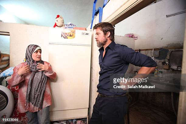 Actor Brad Pitt visits an Iraqi refugee family living in a suburb on October 2, 2009 in Jaramana, near Damascus, Syria. Pitt, traveling with partner...