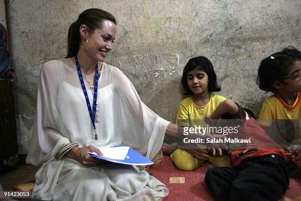 Goodwill Ambassador actress Angelina Jolie visits an Iraqi refugee family living in a suburb on October 2, 2009 in Jaramana, near Damascus, Syria....