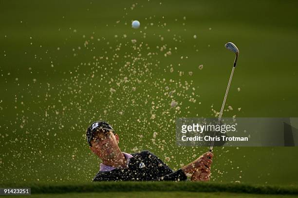 Matt Kuchar plays out of the bunker on the 18th hole at the 2009 Turning Stone Resort Championship at Atunyote Golf Club held on October 4, 2009 in...