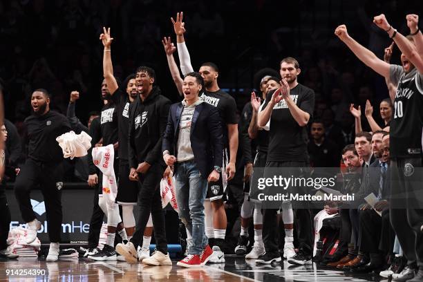 Jeremy Lin and the bench of the Brooklyn Nets react during the game against the Milwaukee Bucks at Barclays Center on February 4, 2018 in the...