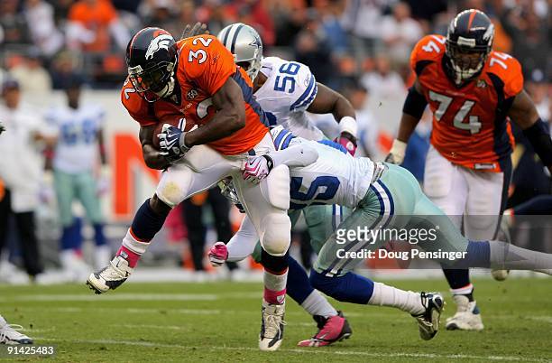 LaMont Jordan of the Denver Broncos rushes against the Dallas Cowboys during NFL action at Invesco Field at Mile High on October 4, 2009 in Denver,...