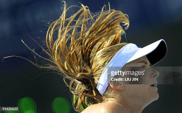 Daniela Hantuchova of Slovakia serves against Carla Suarez Navarro of Spain during their match at the China Open tennis tournament at the National...