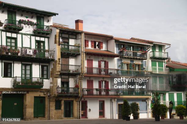 medieval homes line the main square in hondarribia - hondarribia bildbanksfoton och bilder