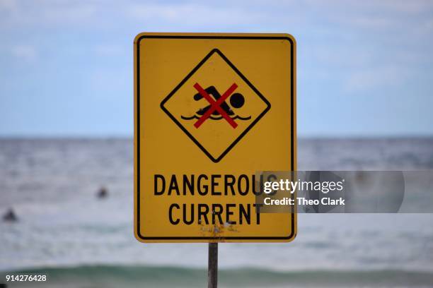 dangerous current beach warning sign - rip tide stock pictures, royalty-free photos & images