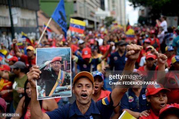 Pro-government activists cheer during a rally to commemorate the 26th anniversary of late Venezuelan President Hugo Chavez's 1992 military coup...