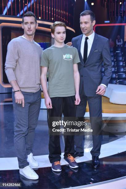Miroslav Klose, Kai Pflaume and a candidate kid during the TV Show 'Klein gegen Gross' on February 4, 2018 in Berlin, Germany.
