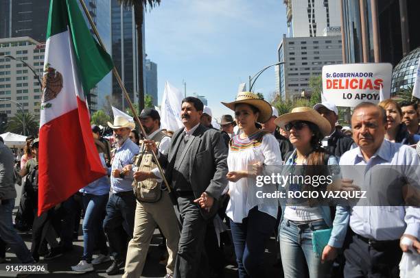 Chihuahua's State Governor Javier Corral marchs during the "Caravan of Dignity" in Mexico City, on February 04, 2018. The march aims to demand the...