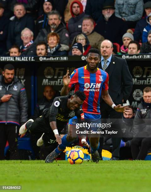 Christian Atsu of Newcastle United is brought down by Timothy Fosu-Mensah of Crystal Palace during the Premier League match between Crystal Palace...