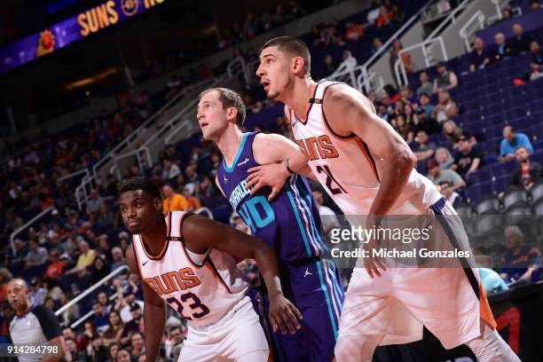 Alex Len of the Phoenix Suns and Danuel House Jr. #23 of the Phoenix Suns on the defense against Cody Zeller of the Charlotte Hornets on February 4,...