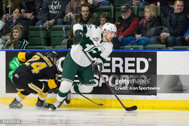Everett Silvertips defenseman Ondrej Vala escapes a check from Brandon Wheat Kings forward Connor Gutenberg during the third period in a game between...