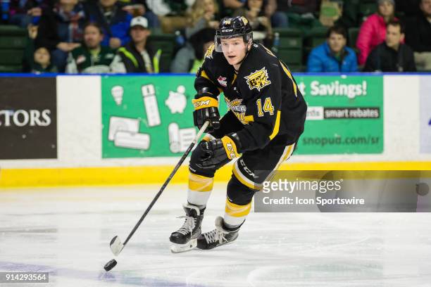 Forward Ty Lewis of the Brandon Wheat Kings brings the puck into the neutral zone during the third period in a game between the Everett Silvertips...