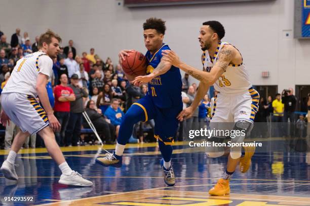 Kangaroos guard Broderick Robinson drives the ball to the basket with Cal State Bakersfield Roadrunners guard Damiyne Durham defending during the...