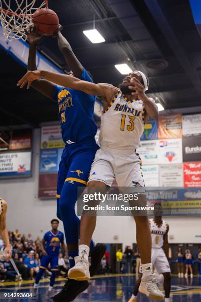 Cal State Bakersfield Roadrunners forward Shon Briggs tries to block the shot from UMKC Kangaroos forward Aleer Leek during the game between the UMKC...