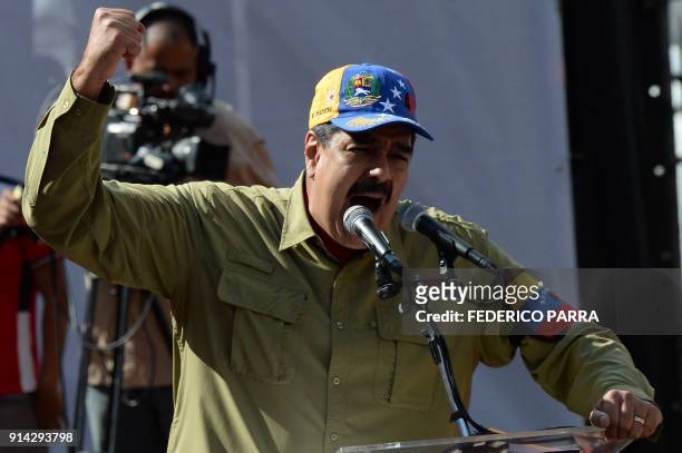 Venezuelan President Nicolas Maduro gives a speech during a rally to commemorate the 26th anniversary of late Venezuelan President Hugo Chavez's 1992...