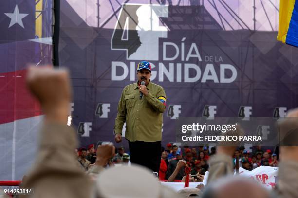 Venezuelan President Nicolas Maduro gives a speech during a rally to commemorate the 26th anniversary of late Venezuelan President Hugo Chavez's 1992...