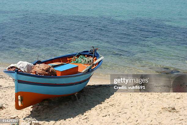 fishing boat on the tunisian beach-africa - rusty anchor stock pictures, royalty-free photos & images