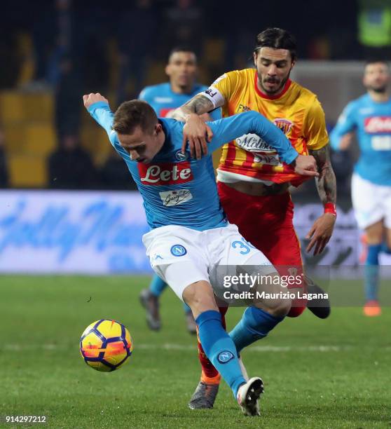 Lorenzo Venuti of Benevento competes for the ball with Marko Rog of Napoli during the serie A match between Benevento Calcio and SSC Napoli at Stadio...