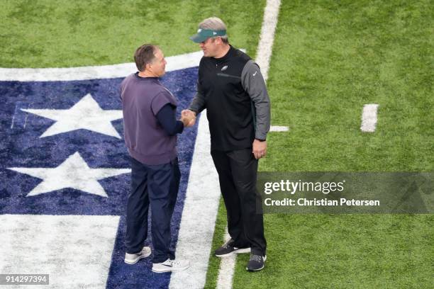 Head coaches Bill Belichick of the New England Patriots and Doug Pederson of the Philadelphia Eagles shake hands prior to Super Bowl LII at U.S. Bank...