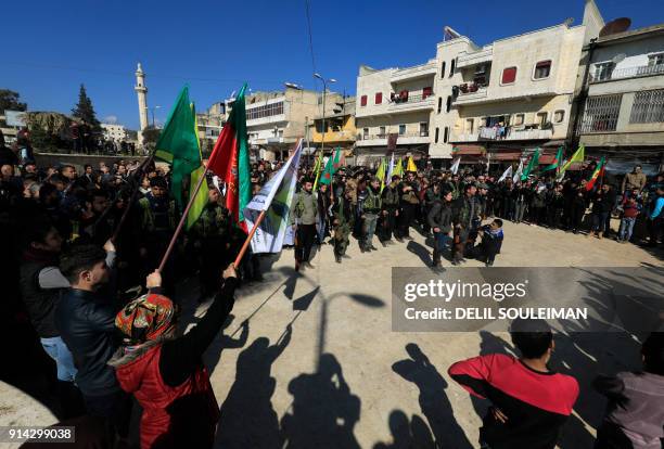 Syrian-Kurds attend an impromptu parade in Afrin as civilians enlist to fight an assault by Turkish troops and allied rebels on the Kurdish People's...