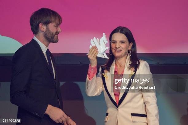 Actress Juliette Binoche joins Jonas Holmberg, Artistic Director of the Gothenburg International Film Festival on stage to accept the Honorary Dragon...