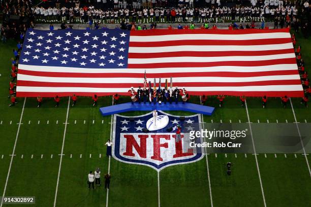 Pink sings the national anthem prior to Super Bowl LII between the New England Patriots and the Philadelphia Eagles at U.S. Bank Stadium on February...