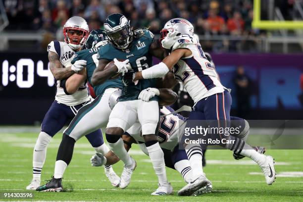 Jay Ajayi of the Philadelphia Eagles is tackled by Elandon Roberts of the New England Patriots during the first quarter in Super Bowl LII at U.S....
