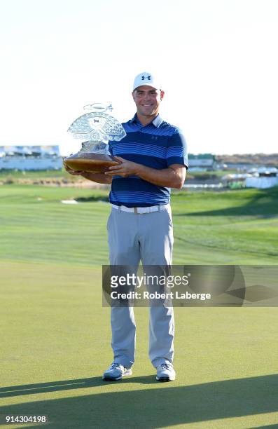 Gary Woodland poses with the trophy after winning the Waste Management Phoenix Open at TPC Scottsdale on February 4, 2018 in Scottsdale, Arizona.