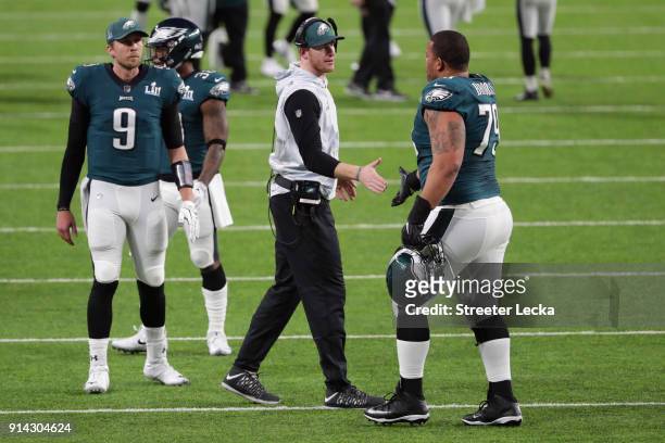 Brandon Brooks is congratulated by his teammate Carson Wentz of the Philadelphia Eagles after their first quarter field goal against the New England...