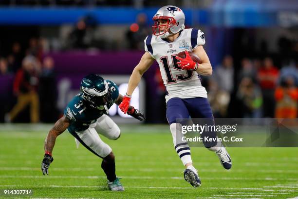 Chris Hogan of the New England Patriots carries a 28-yard reception past Jalen Mills of the Philadelphia Eagles during the first quarter in Super...
