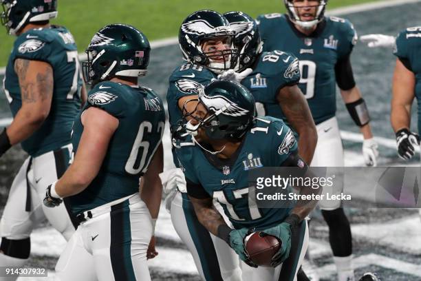 Alshon Jeffery of the Philadelphia Eagles is congratulated by his teammates after scoring a 34-yard touchdown reception during the first quarter...