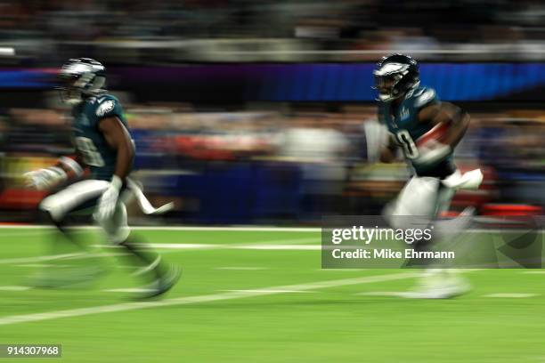 Corey Clement of the Philadelphia Eagles carries the ball against the New England Patriots in the first quarter in Super Bowl LII at U.S. Bank...