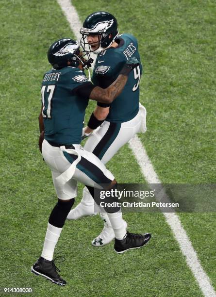 Nick Foles and Alshon Jeffery of the Philadelphia Eagles celebrate a 34-yard touchdown pass against the New England Patriots in the first quarter of...