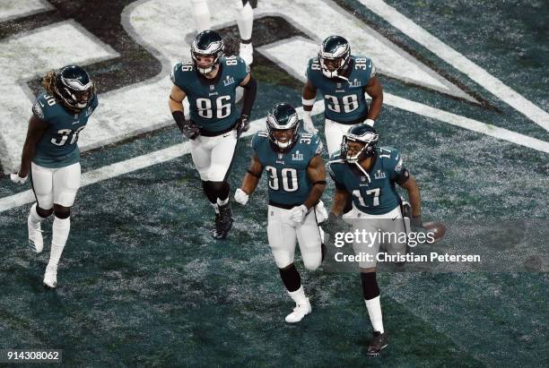 Alshon Jeffery and teammates of the Philadelphia Eagles celebrate a 34-yard touchdown pass against the New England Patriots in the first quarter of...