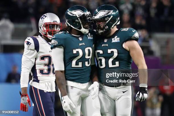 LeGarrette Blount and Jason Kelce of the Philadelphia Eagles react to the play during the first quarter against the New England Patriots in Super...