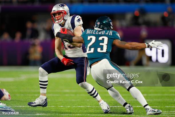 Chris Hogan of the New England Patriots attempts to carry the ball past Rodney McLeod of the Philadelphia Eagles during the first quarter in Super...